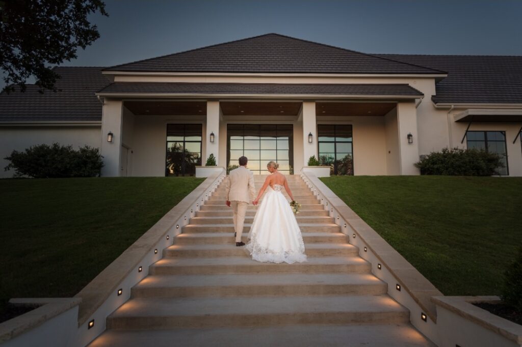Bride and groom walking upstairs towards The Arlo in Austin.